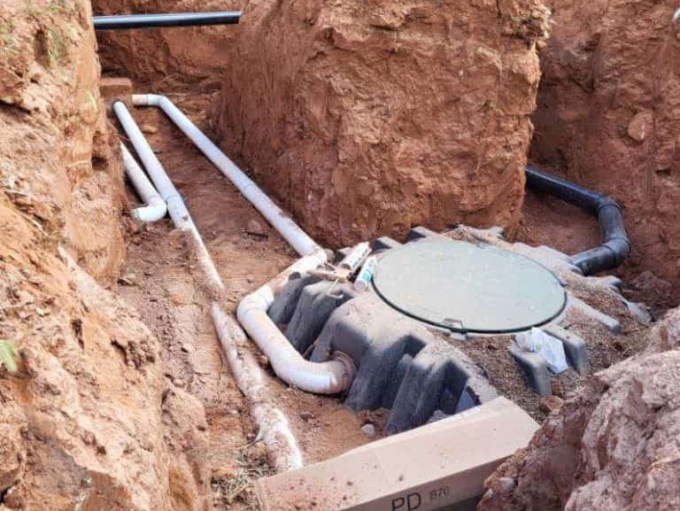Advanced Septic Service performing an alternative septic installation in rocky Cornville, AZ soil.